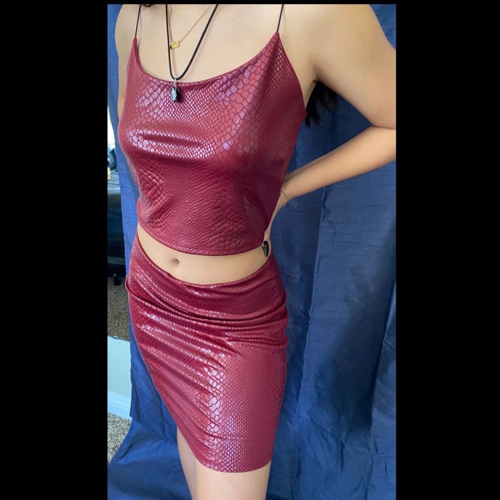 A two piece red top and skirt